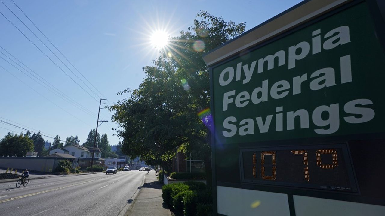 A display at an Olympia Federal Savings branch shows a temperature of 107 degrees