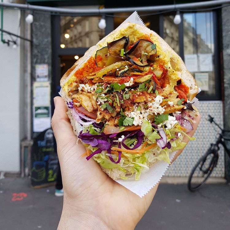 At Gemus, traditional Turkish bread is garnished with vegetables, including marinated red cabbage, like the Berlin Döner.